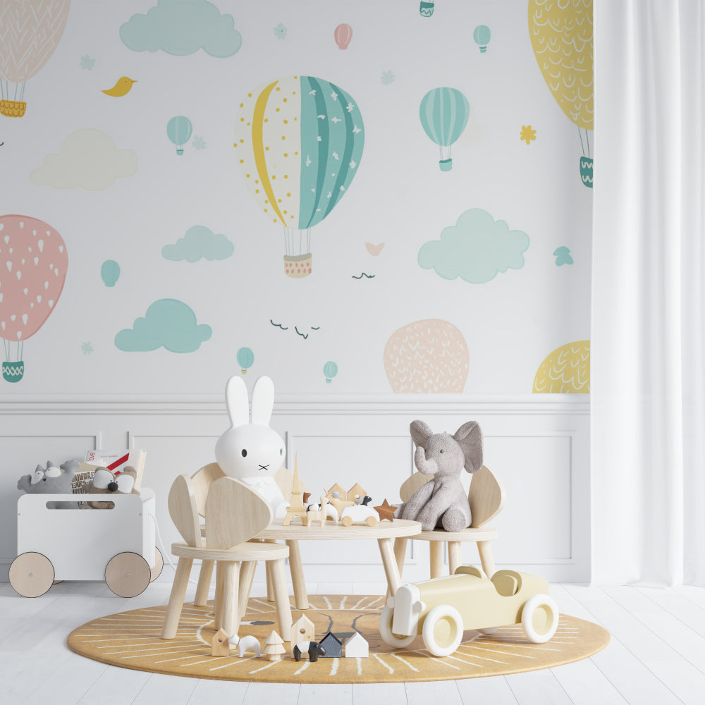 Pastel balloon mural creating depth in a cozy reading nook