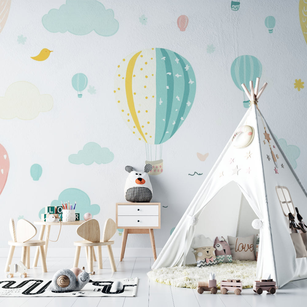 Kids bedroom featuring hot air balloon wallpaper with soft lighting