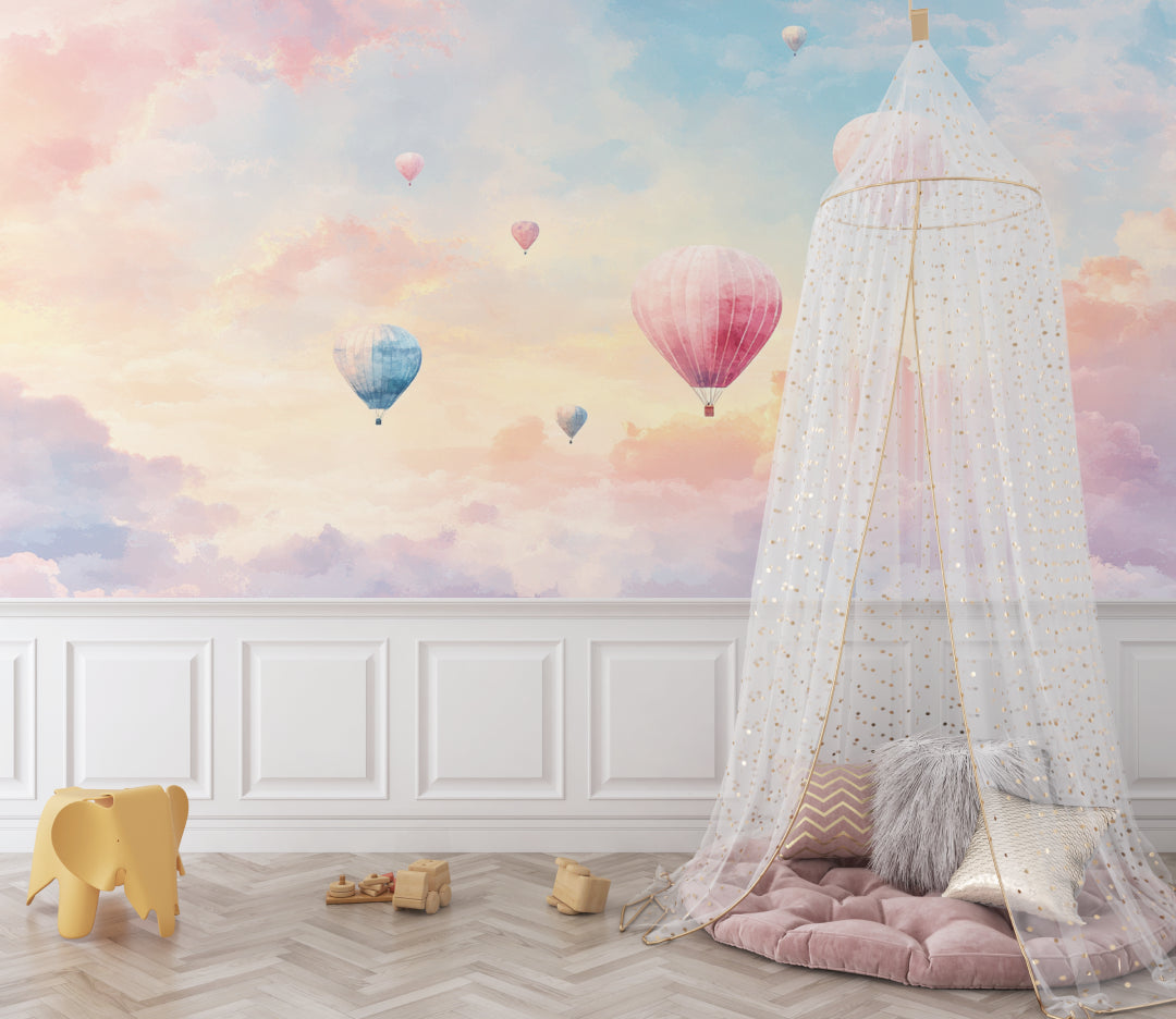 Hot air balloon wallpaper in a bright nursery with white furniture, showing soft pastel colors and floating balloons