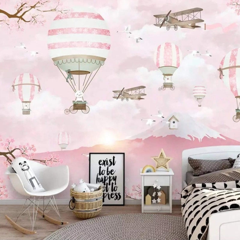 Pink hot air balloon mural displayed in a children's reading nook with cozy cushions