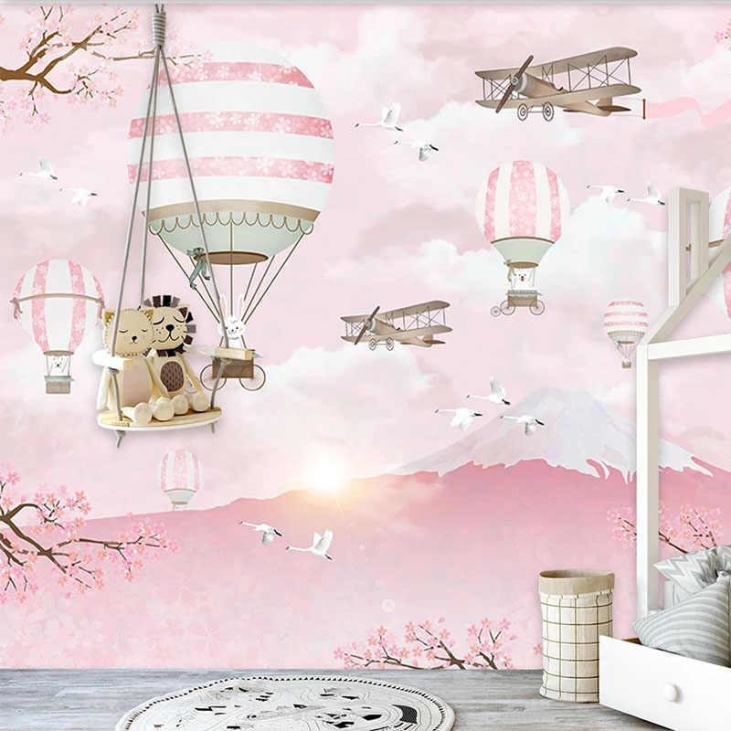 Cherry blossom wallpaper with hot air balloons featured in a girl's bedroom with matching decor