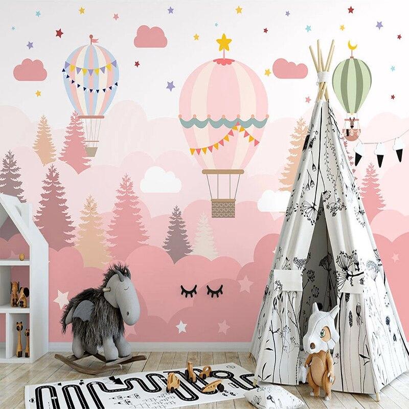 Adventure themed hot air balloon wallpaper bringing magic to a reading nook with soft pink forest background