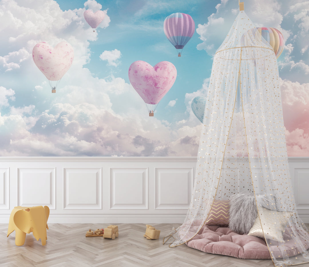 Pink heart balloon mural creating depth in a kids playroom with reading nook