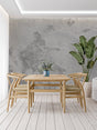Modern concrete effect wallpaper in minimalist living room showing urban texture and depth