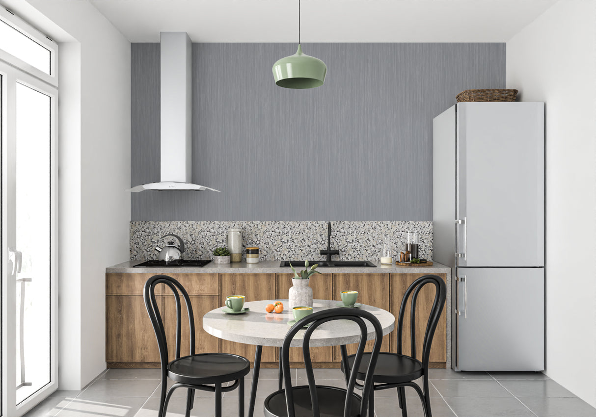 Grey industrial wallpaper in hotel lobby showcasing vertical stripes