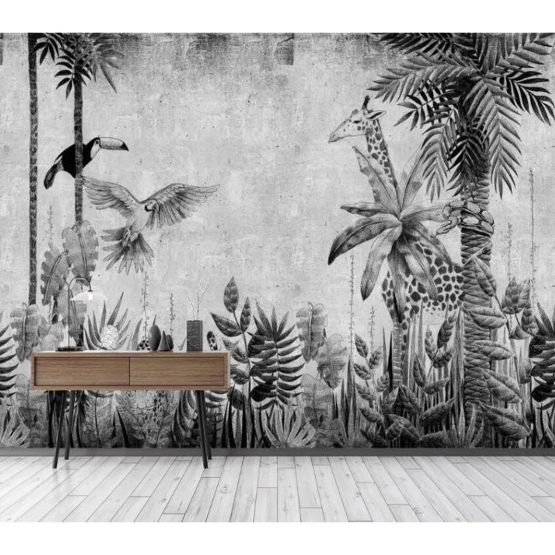 Black and white jungle scene mural installed in office space with minimal furniture