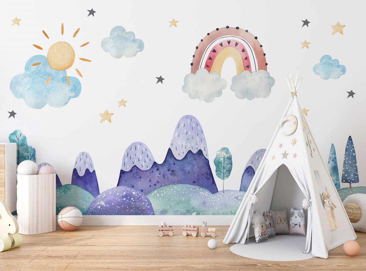 Mountain nursery wallpaper with rainbow creates a magical atmosphere in a cozy nursery with white furniture