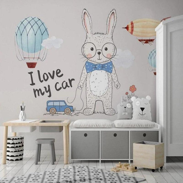 Nursery wall mural with bunny and hot air balloons creating a cozy atmosphere in a modern nursery room