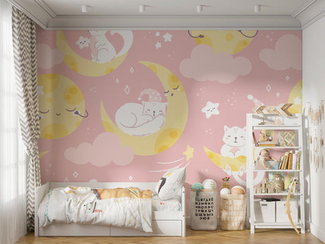 Magical cat and moon wallpaper creating a cozy atmosphere in a modern nursery with soft pink walls and white furniture