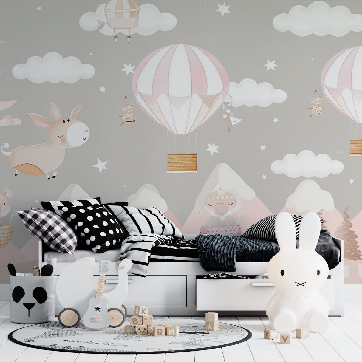 Dreamy balloon wallpaper in baby girl nursery with grey crib