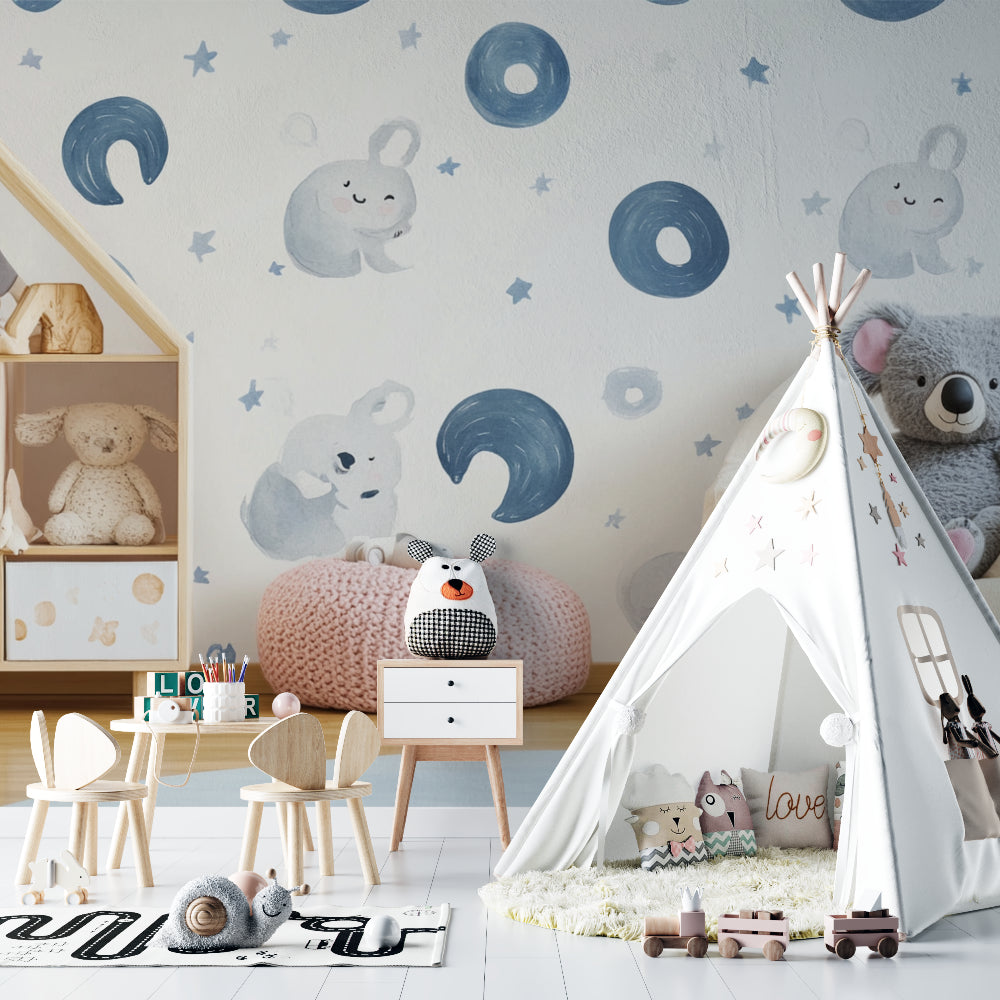 Kids room with koala and moon wallpaper featuring soft blue accents