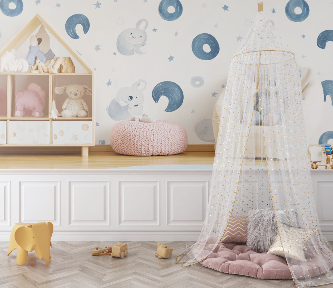 Nursery wallpaper with koalas and moons in a gender-neutral baby room
