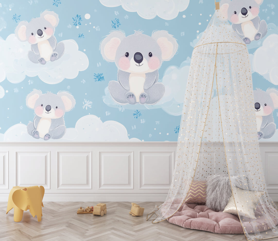 Blue koala wallpaper brightening up a small nursery with white furniture