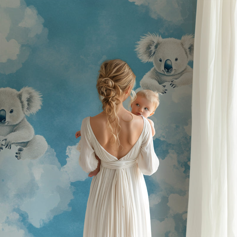 Baby room with koala cloud wallpaper creating a soft, dreamy atmosphere for naptime