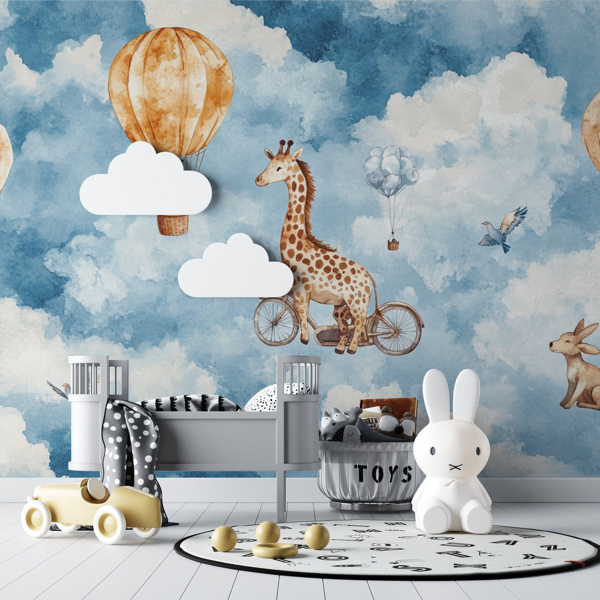Magical hot air balloon mural in baby room with white furniture