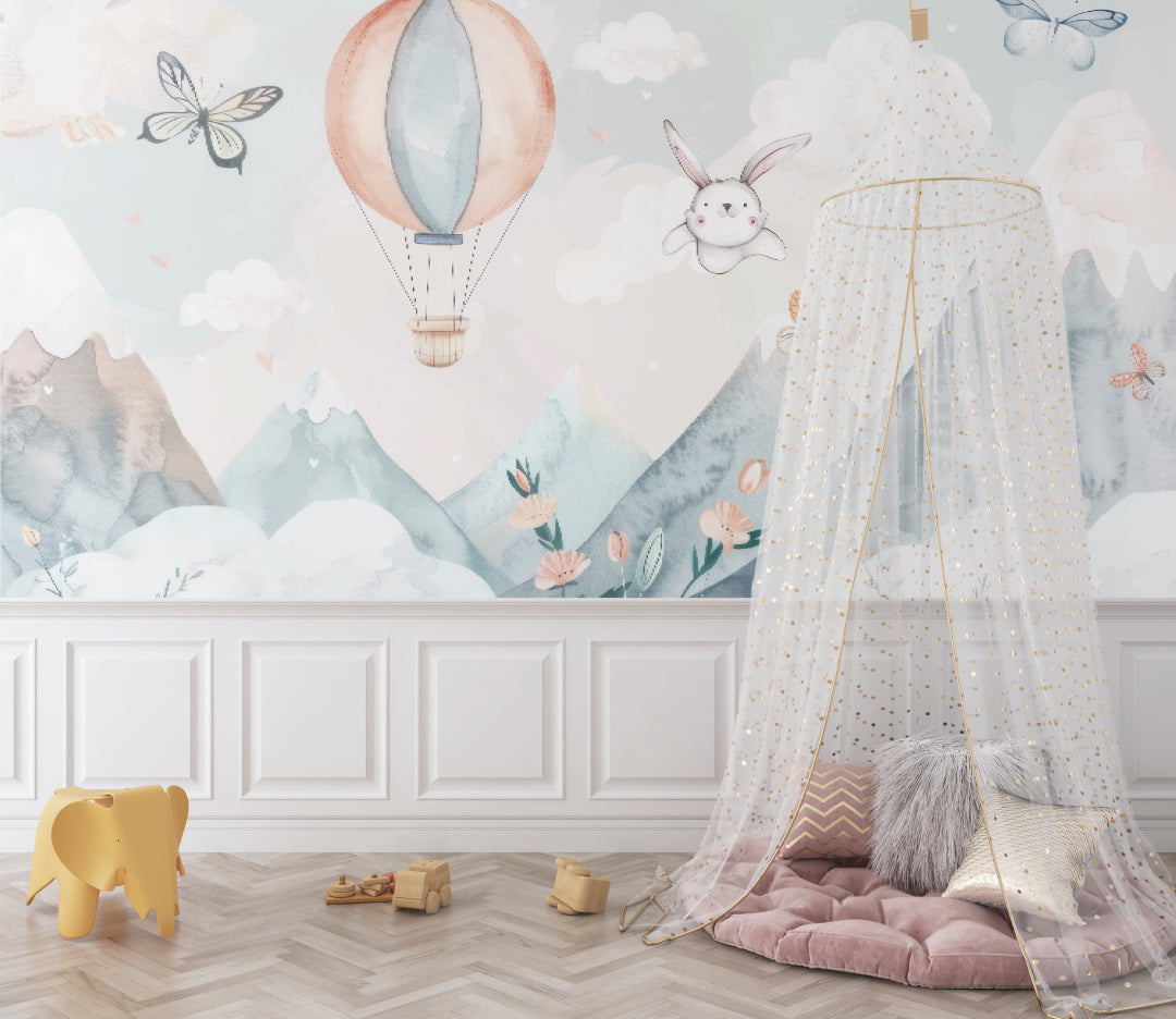 Kids room with hot air balloon mural wallpaper creating a cozy reading nook