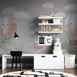 Hot air balloon kids wallpaper in a bright nursery with white furniture and pink accents