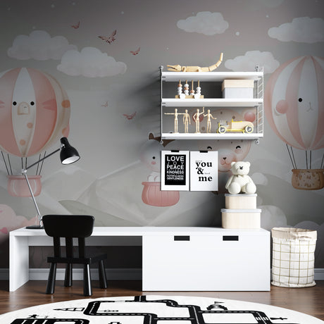 Hot air balloon kids wallpaper in a bright nursery with white furniture and pink accents