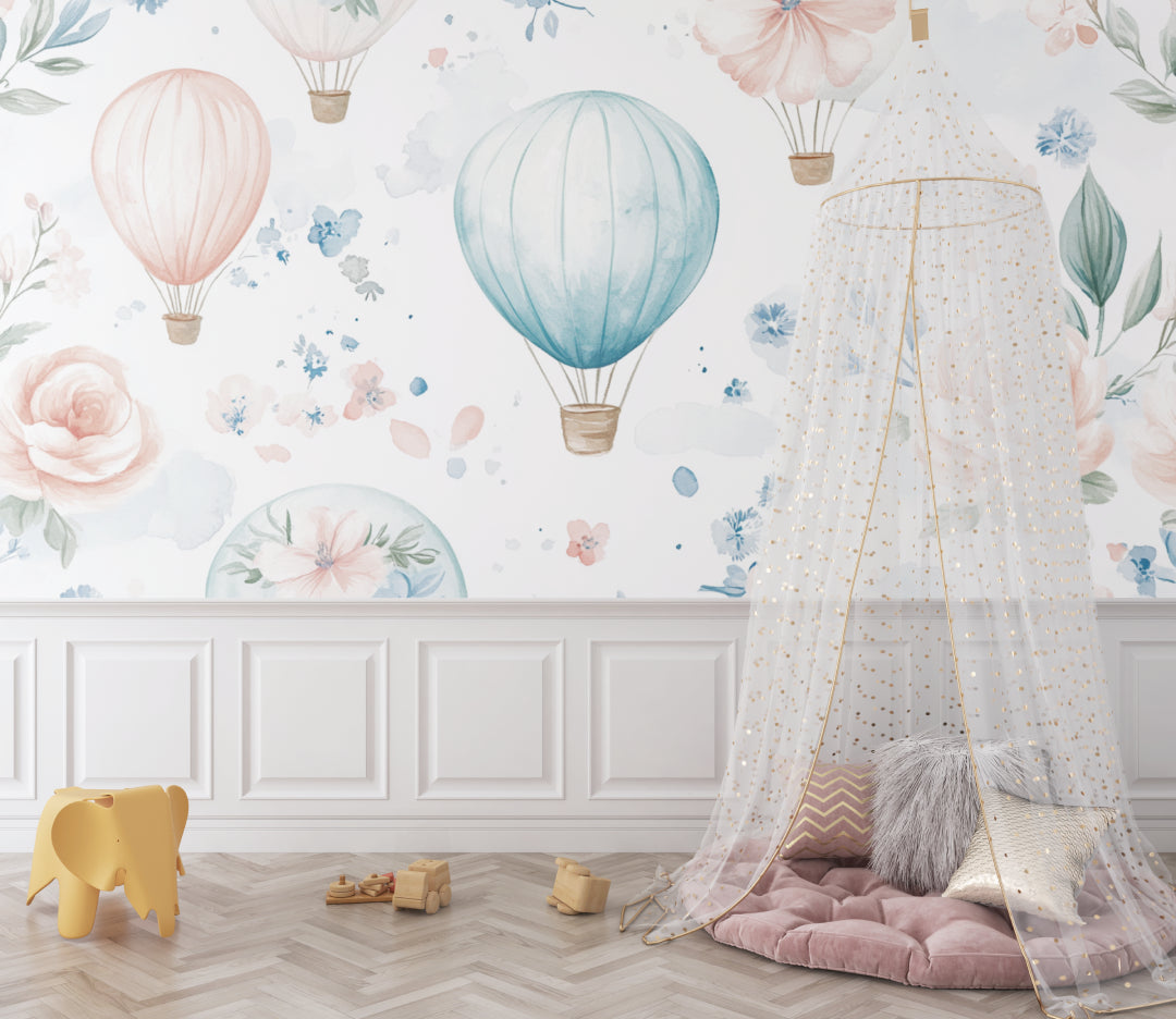 Watercolor hot air balloon mural in a playroom with natural light and wooden toys