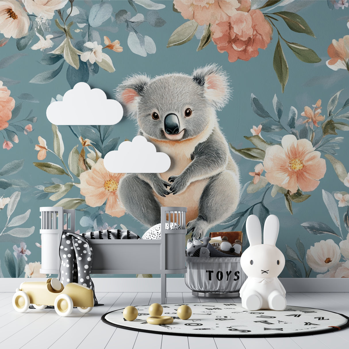 Koala wallpaper mural in bright nursery with white furniture and natural light showing peaceful garden design
