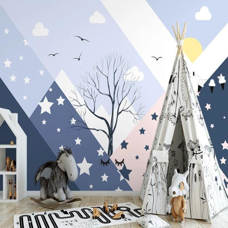Playroom wall decorated with mountain stars wallpaper showing scale and soft color palette