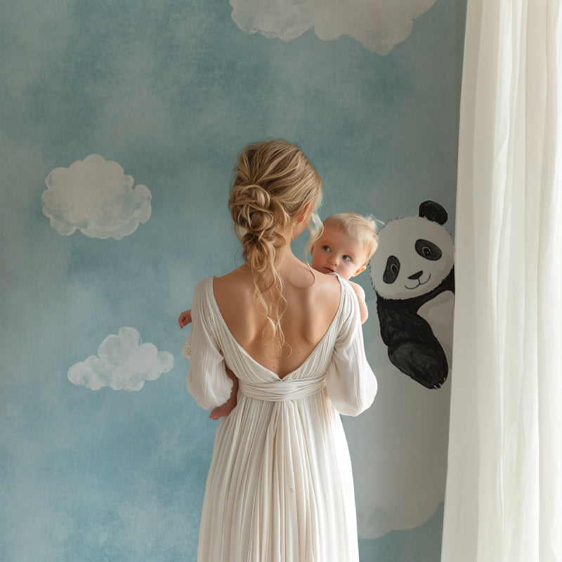 Panda nursery wallpaper creating a peaceful atmosphere in a modern white nursery with wooden furniture