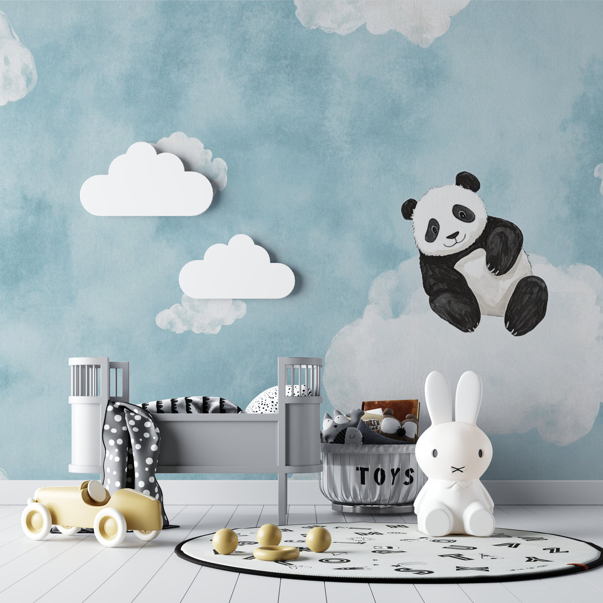 Cloud and panda wall mural bringing joy to a cozy reading nook in a kids bedroom