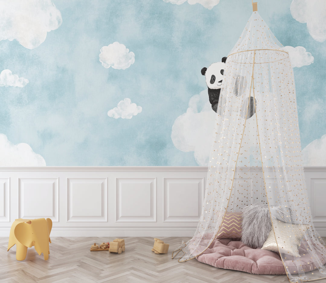 Kids room with panda mural wallpaper creating a dreamy atmosphere above white furniture