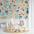 Hand-drawn animal wallpaper creating a cozy atmosphere in a modern nursery with natural light