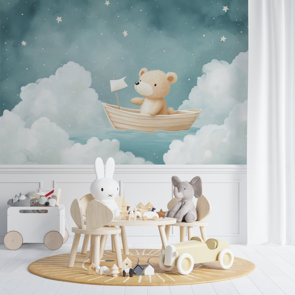 Teddy bear sailing wallpaper in a cozy nursery with white crib and star mobile