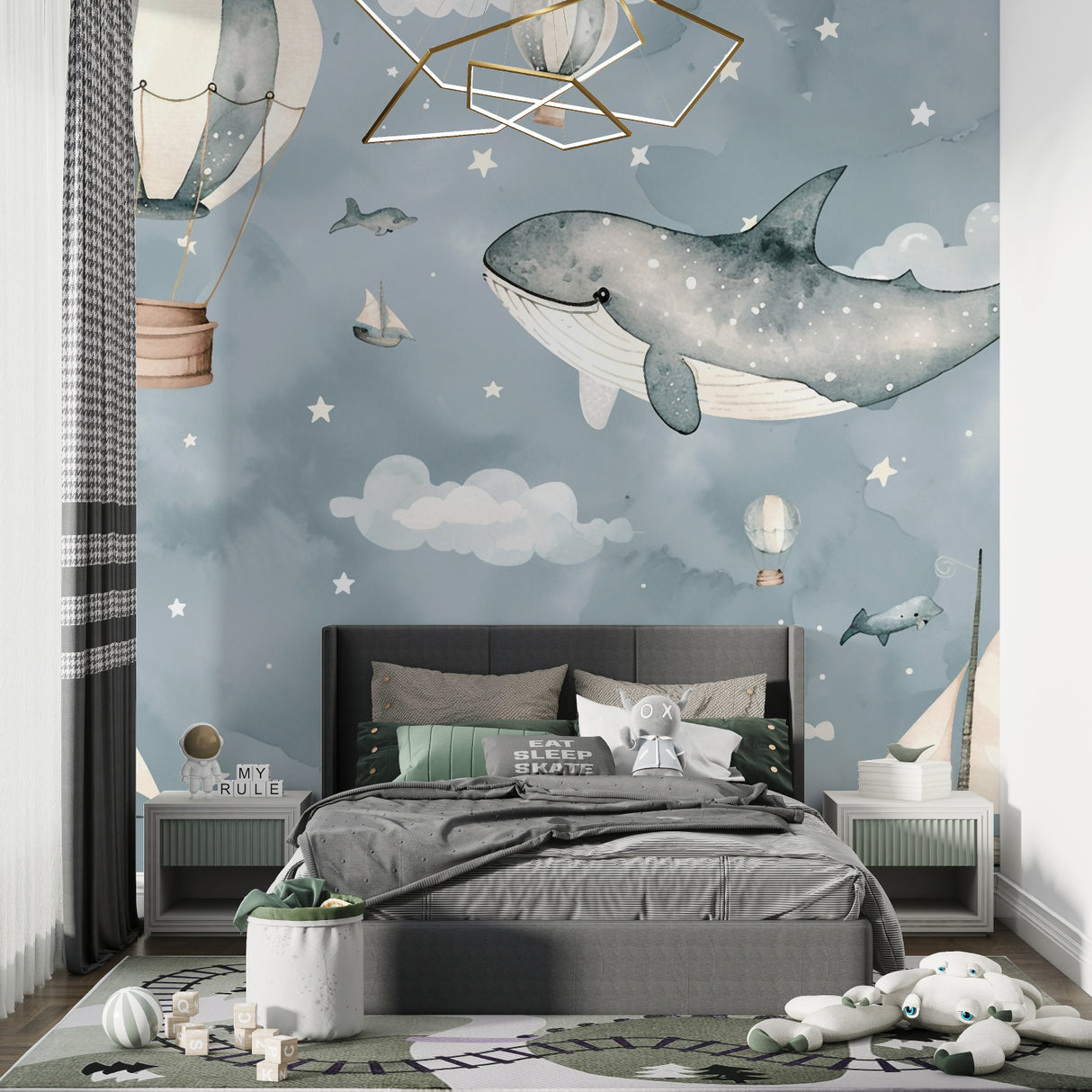 Playroom wall with whimsical whale and balloon mural creating magical atmosphere