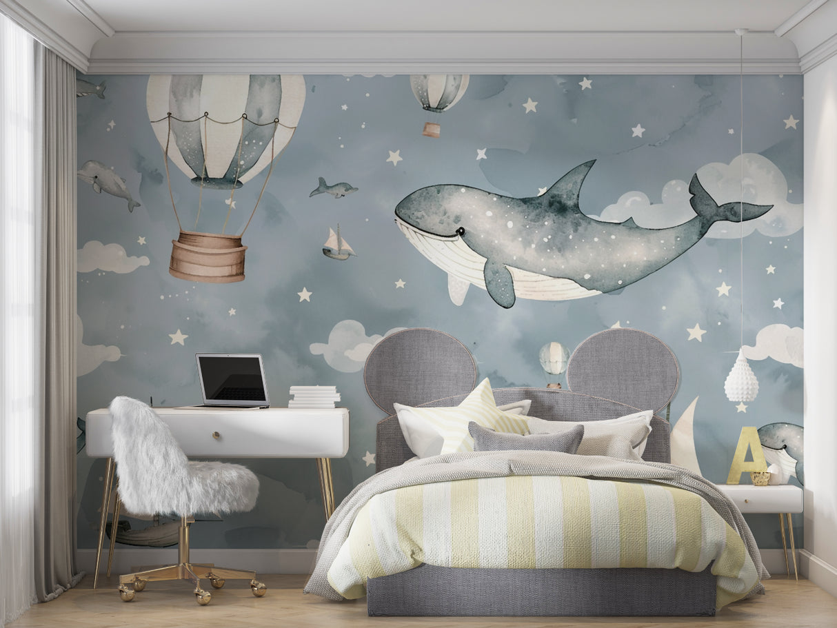 Baby room with gentle marine theme wallpaper showing floating whale and balloons