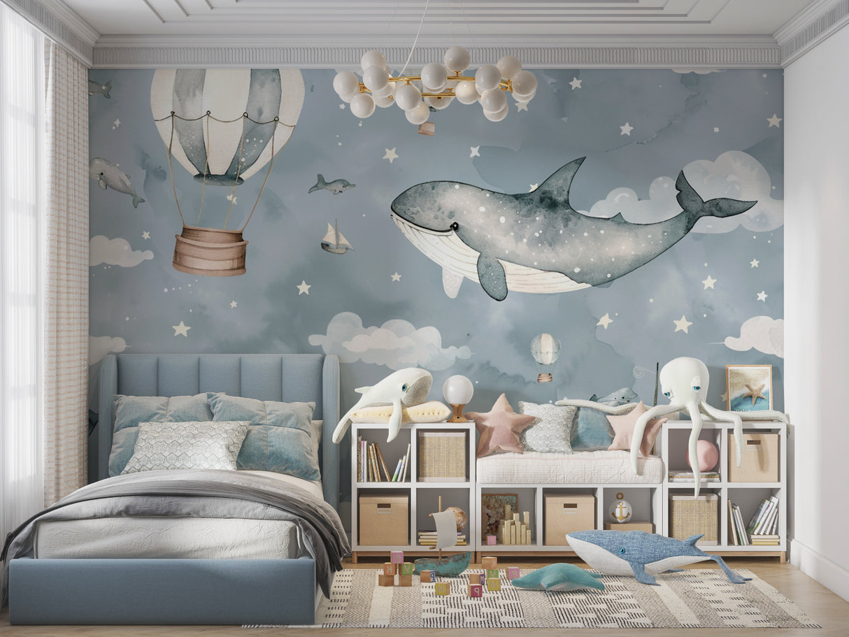 Reading nook with dreamy sky and sea wallpaper featuring gentle whale design
