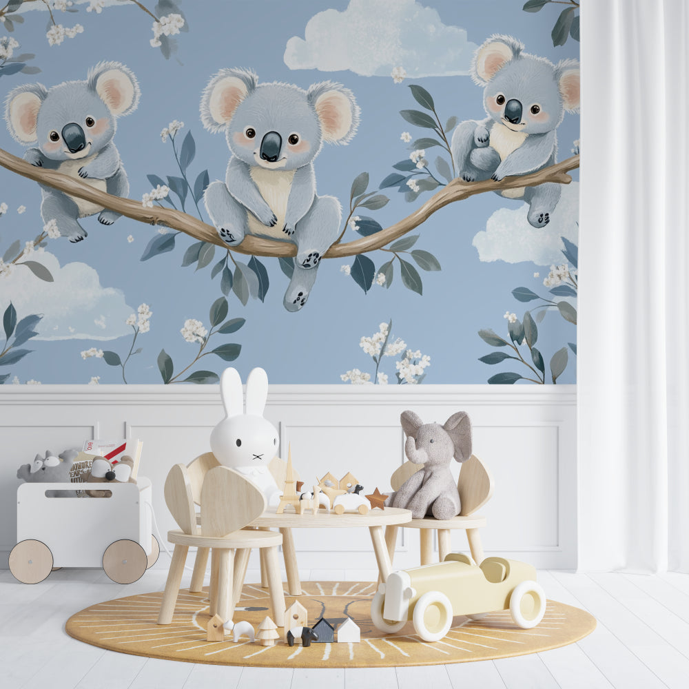 Koala nursery wallpaper in a modern white nursery with natural wood furniture