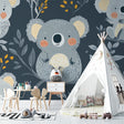 Koala wallpaper in a modern nursery with grey and gold accents, creating a cozy atmosphere