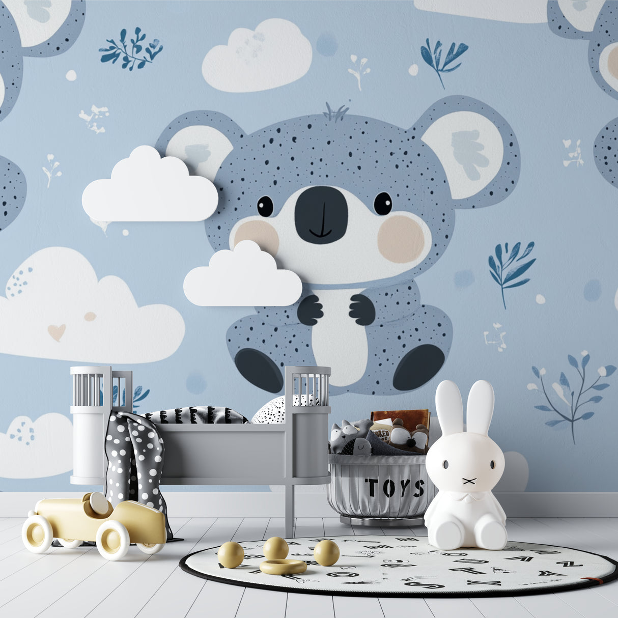 Koala nursery wallpaper creates a peaceful atmosphere in a modern baby room with white furniture