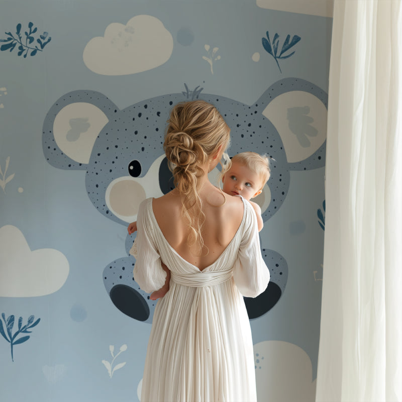Sweet koala wall mural brightens up a toddler's bedroom with soft blue tones