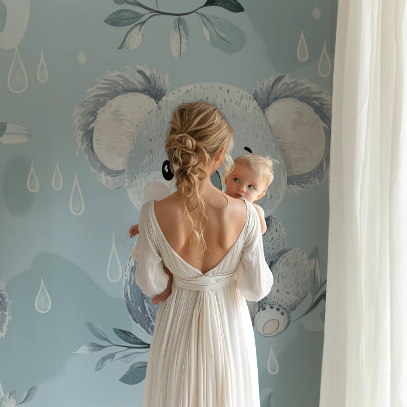 Nursery corner with koala rain drops wallpaper and natural wood elements