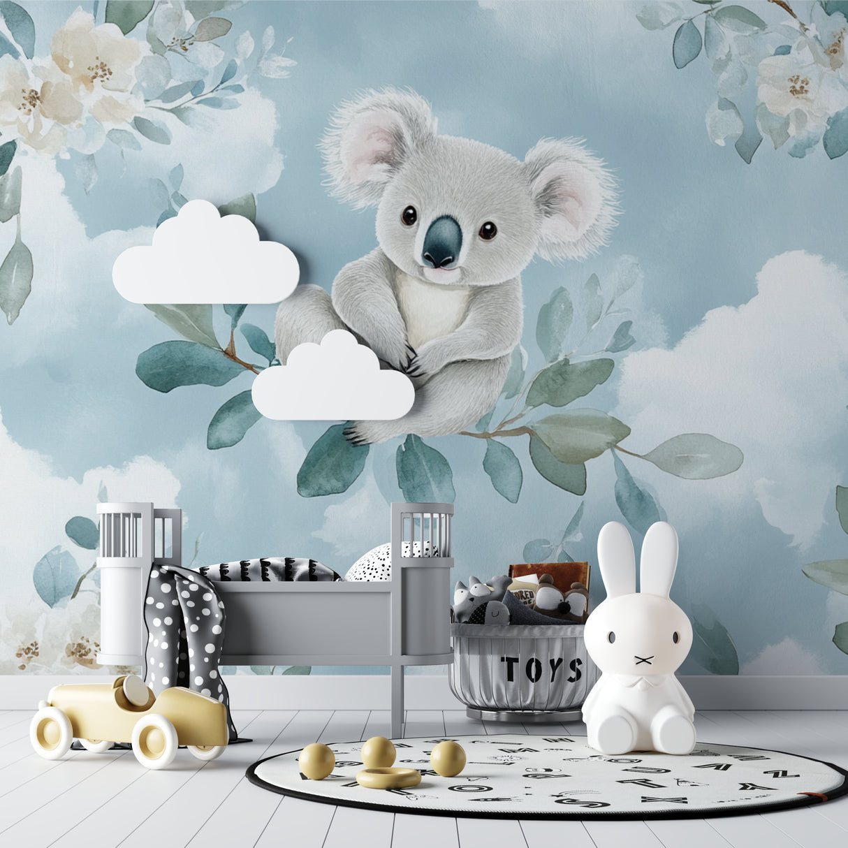 Koala nursery wallpaper mural in a modern baby room with white furniture and natural light