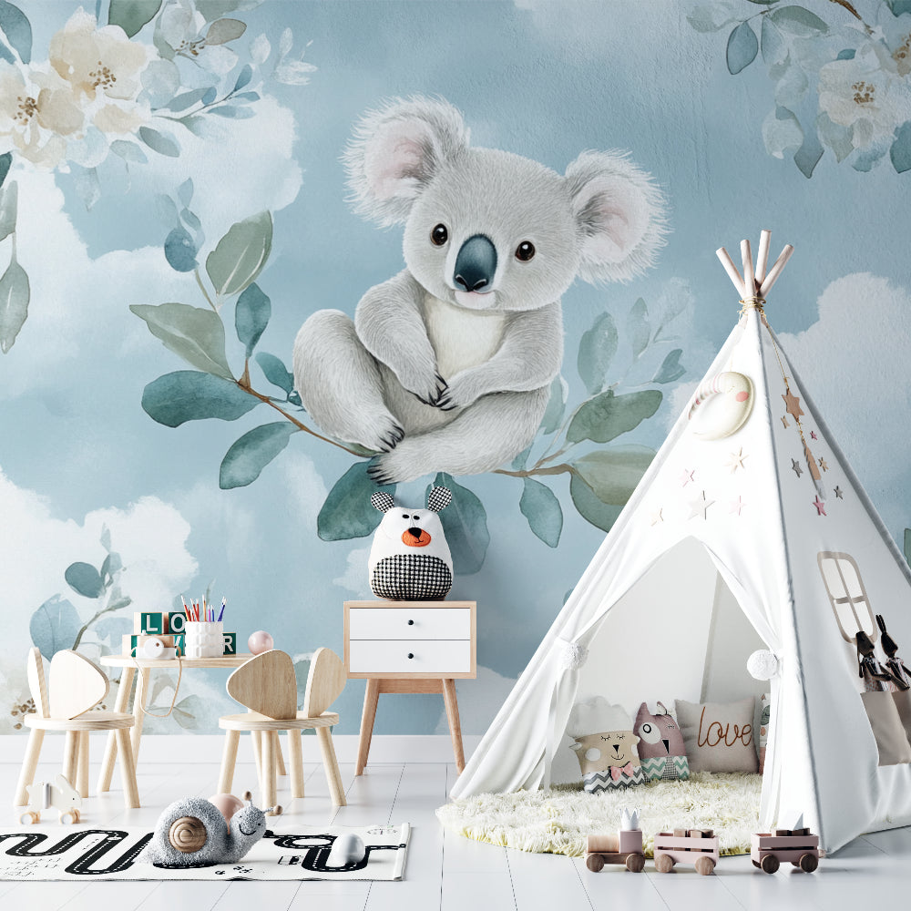 Blue koala wall mural creating a cozy reading nook in a toddler's bedroom