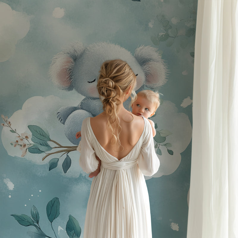 Dreamy koala wallpaper in a gender-neutral nursery with white furniture