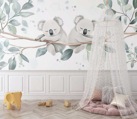 Koala nursery wallpaper creating a peaceful atmosphere in a modern white nursery with natural wood furniture