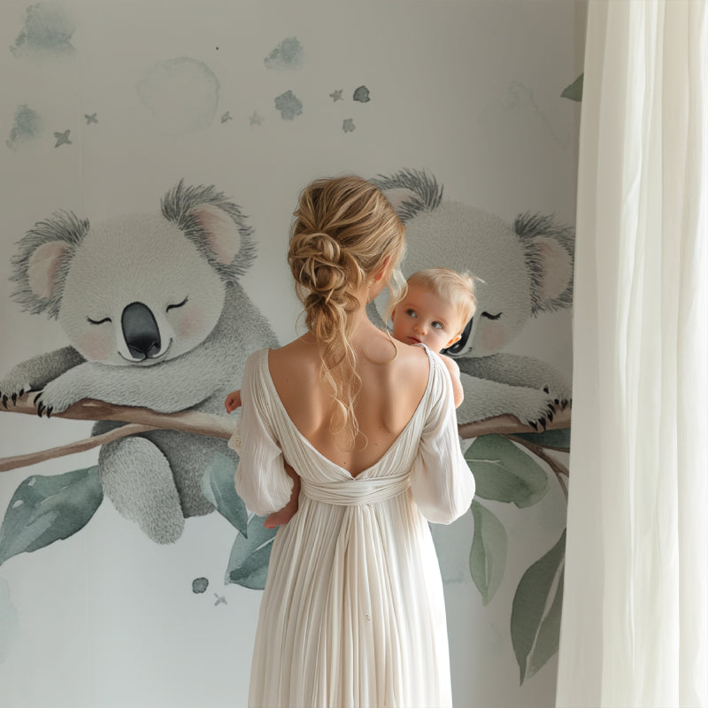 Dreamy koala mural wallpaper complementing a Scandinavian-style playroom setup