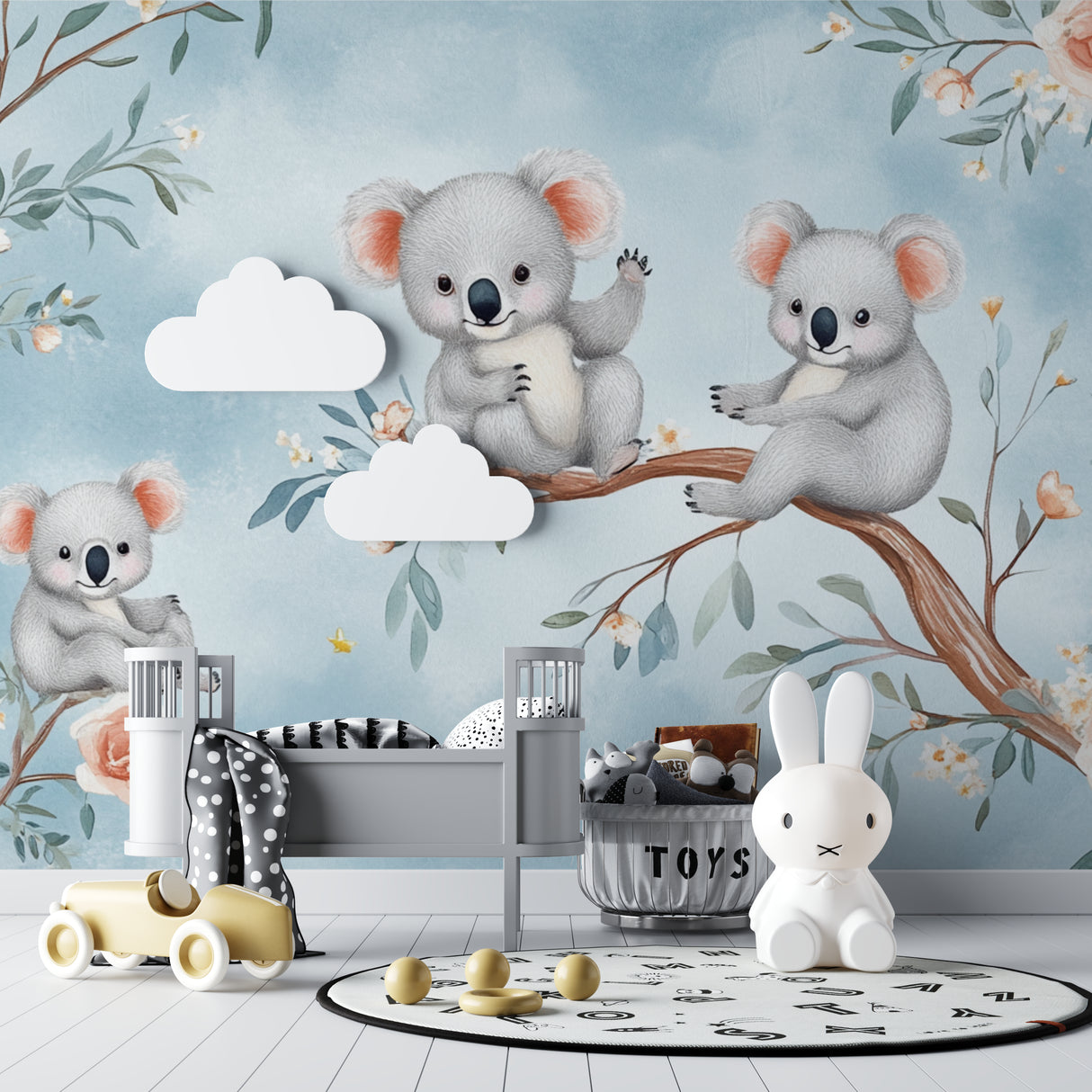 Koala nursery wallpaper creating a peaceful atmosphere in a modern white nursery with natural wood furniture