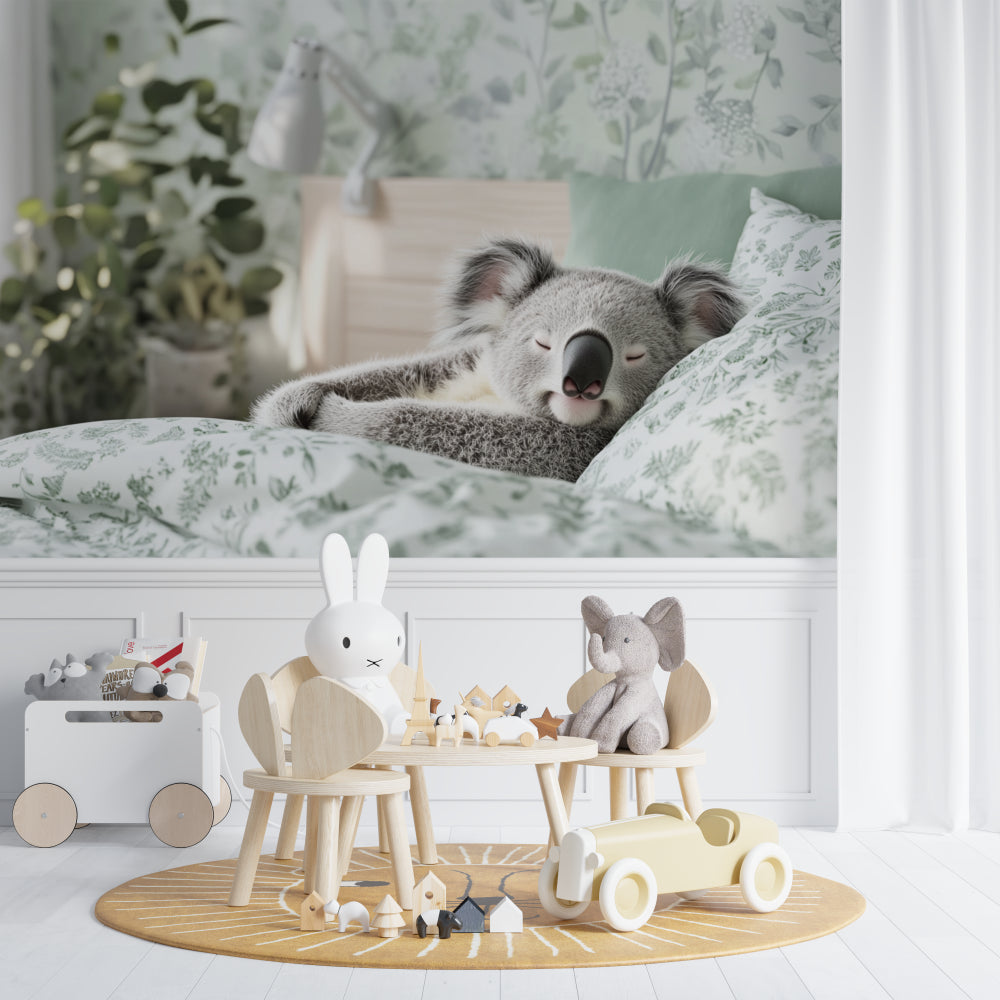 Koala nursery wallpaper styled in a modern baby room with white furniture and natural light
