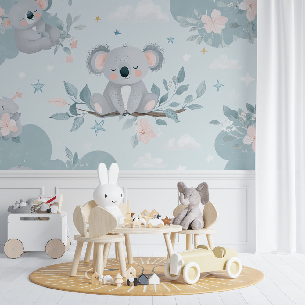 Koala nursery wallpaper in a soft-lit baby room with white furniture and blush accents