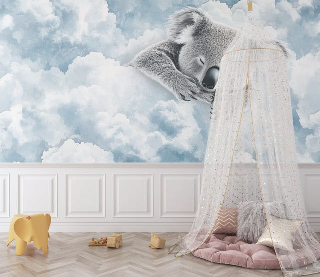 Koala cloud wallpaper in a cozy nursery with soft lighting and wooden furniture