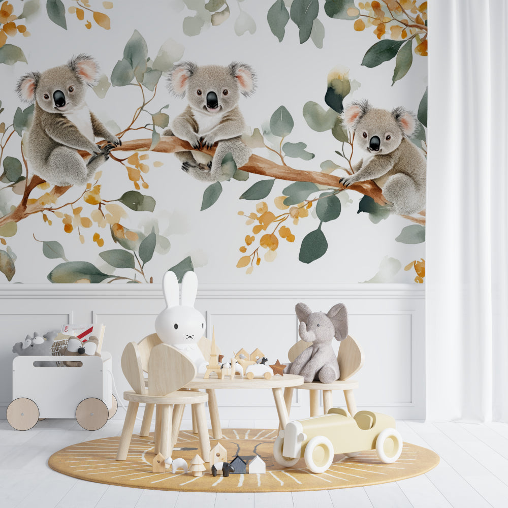 Koala wallpaper mural styled in a modern nursery with white furniture and natural decor