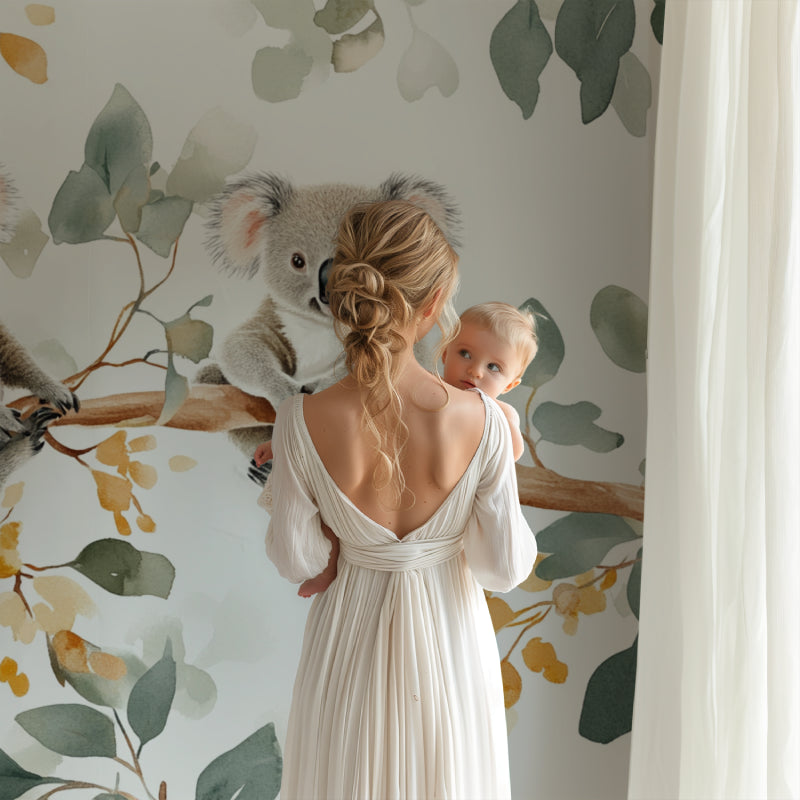 Koala and eucalyptus mural creating a calming atmosphere in a baby's room