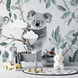 Koala wallpaper mural creating a peaceful atmosphere in a modern nursery with white furniture